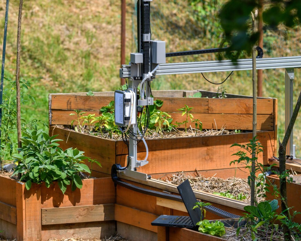 plant-growing-robot-farmbot-connected-to-a-laptop-2025-03-09-18-24-23-utc