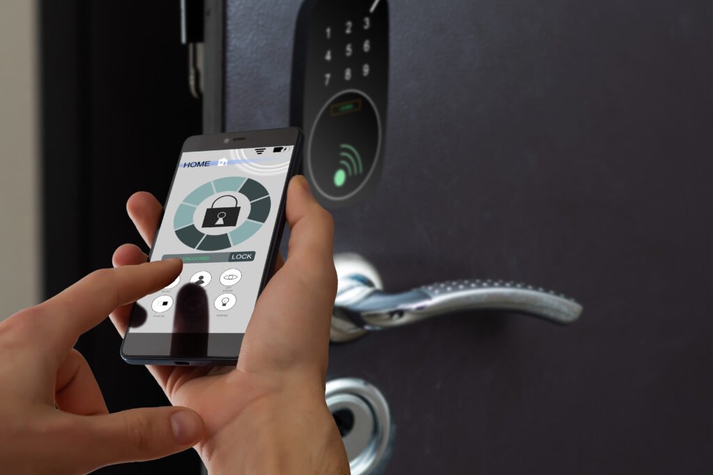 smart house, home automation, device with app icons. Man uses his smartphone with smarthome security app to unlock the door of his house.